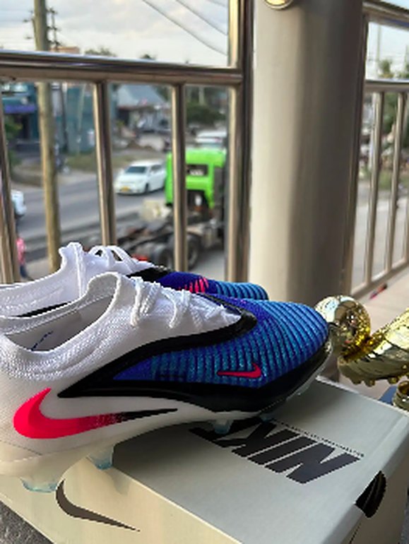 White and blue football boots