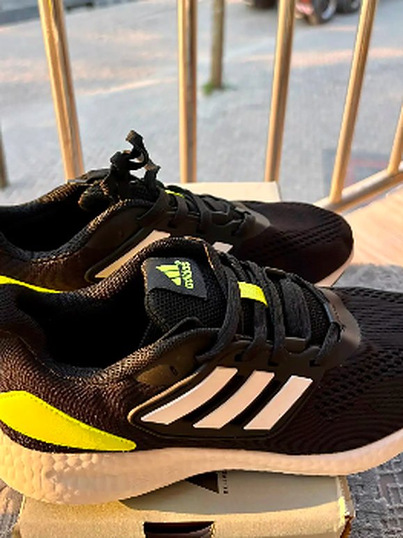 Black and yellow running shoes