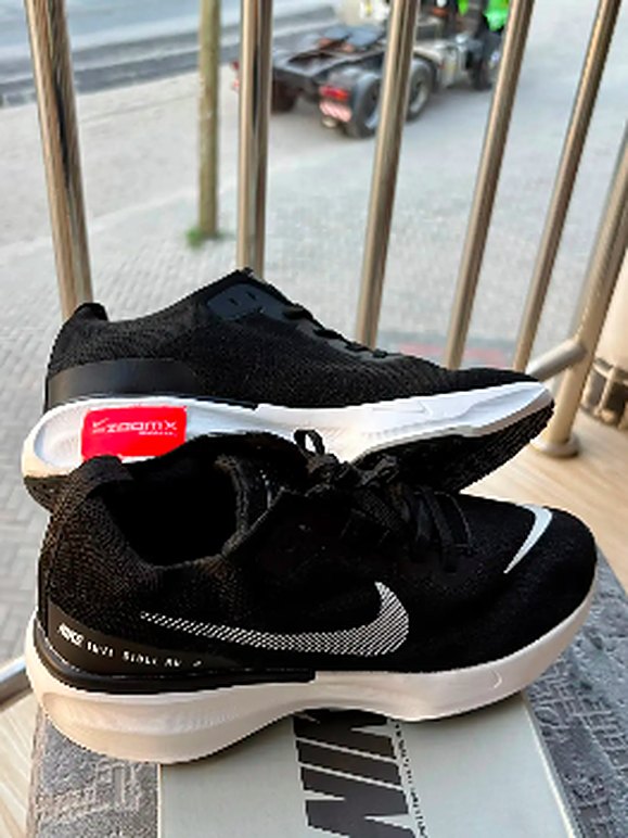 Black running shoes with white sole