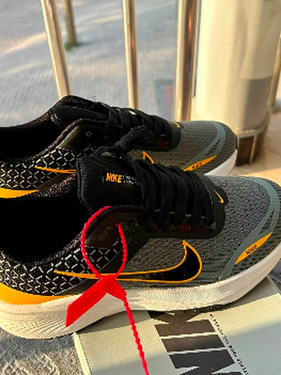 Grey and orange running shoes