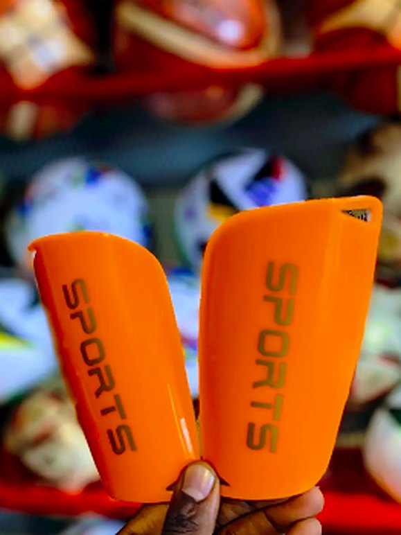 Orange shin guards