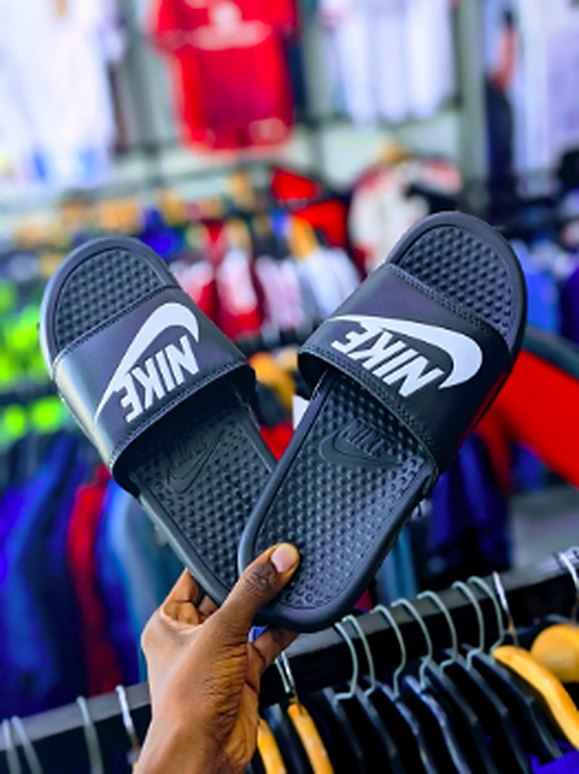 Black slides with white strap